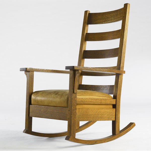 L. & J.G. STICKLEY High-back rocker (no. 485): L. & J.G. STICKLEY High-back rocker (no. 485) with drop-in spring seat covered in caramel leather. Handcraft decal. 43'' x 28 1/2'' x 29''