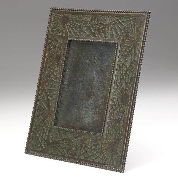 RIVIERE STUDIOS Pinecone picture frame: RIVIERE STUDIOS Bronze picture frame in the style of Tiffany Studios' Pinecone pattern, lined in green slag glass. Unmarked. 9 1/2'' x 7 3/4''