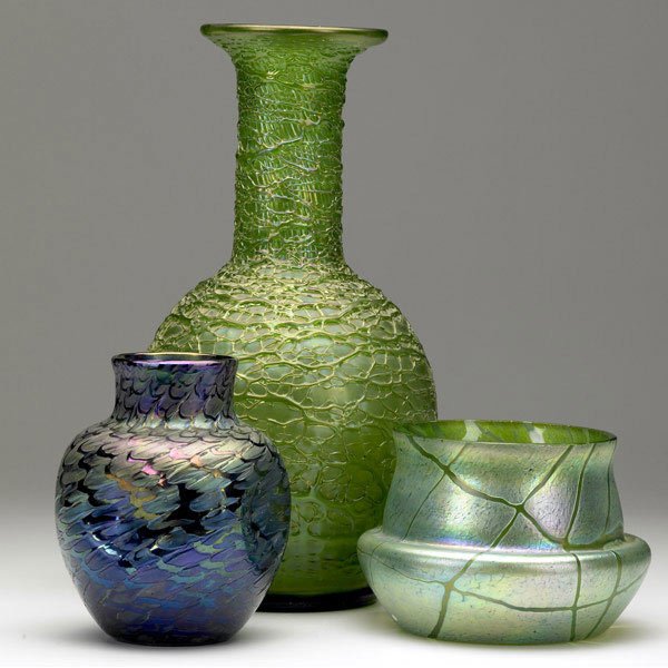 AUSTRIAN GLASS Three vases: AUSTRIAN GLASS Three art glass vases in the style of Loetz. Small nicks and possible grinding to jardiniere. Unmarked. Tallest 14''