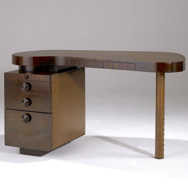 GILBERT ROHDE / HERMAN MILLER Paldao desk: GILBERT ROHDE / HERMAN MILLER Paldao desk in mahogany veneer with leatherette-covered three-drawer pedestal and leg, with single pull-out shelf. 29 1/2'' x 52'' x 31''