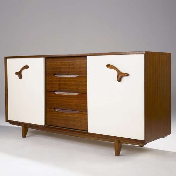 PAUL LASZLO / BROWN SALTMAN Mahogany cabinet: PAUL LASZLO / BROWN SALTMAN Mahogany cabinet with two cream-colored laminate sliding doors flanking four center drawers. 37'' x 74'' x 20''