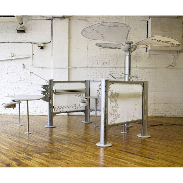 AYSE BIRSEL / HERMAN MILLER Resolve Cubicle System: AYSE BIRSEL / HERMAN MILLER Resolve Cubicle System workstation with two desks, each with three adjustable lights, a monitor shelf and accessory shelf, swing-out drawers, and printed cloth panels. Unma