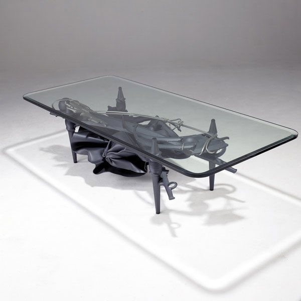 ALBERT PALEY Pedestal dining table: ALBERT PALEY Coffee table of formed and fabricated steel with rectangular bevel-edged glass top, 1997. Stamped Albert Paley 1997, with copyright. 27 1/2'' x 66'' x 29 1/2''