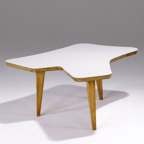 JENS RISOM Custom-designed freeform coffee table: JENS RISOM Custom-designed freeform coffee table with white laminate top on maple base, ca. 1948. Early Jens Risom paper label. 16'' x 41 1/4'' x 40''