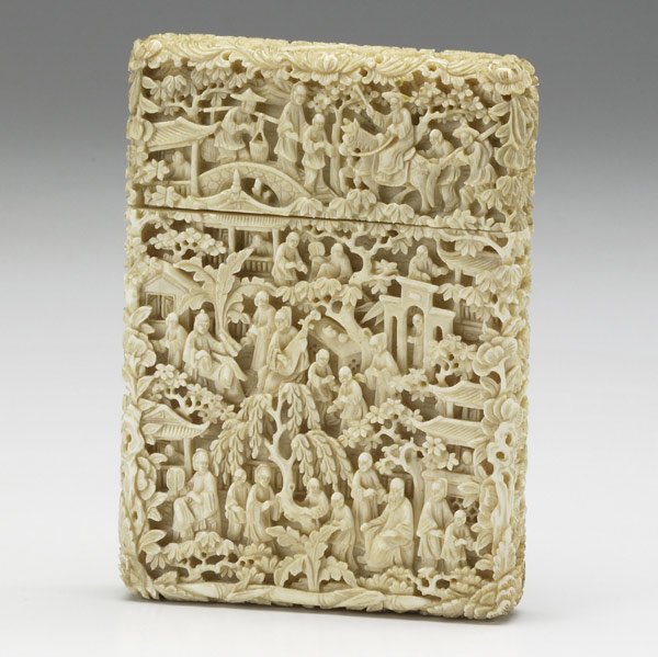 Ivory card case: Ivory card case, 19th C. Profusely carved with figures and trees on all sides. Minor damage at edge. 5'' x 3 1/2''