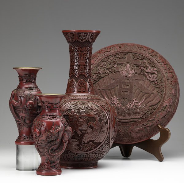 Four pieces of cinnabar: Four pieces of cinnabar, 19th/20th C. Tall gourd-shaped vase with hole in base, pair of serpent-encrusted vases and a large, round covered box. Tallest: 16''