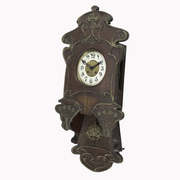 Art Nouveau wall clock: Art Nouveau wall clock, German or Austrian, ca. 1900. Oak with applied brass decoration. Time and strike movement. 34''