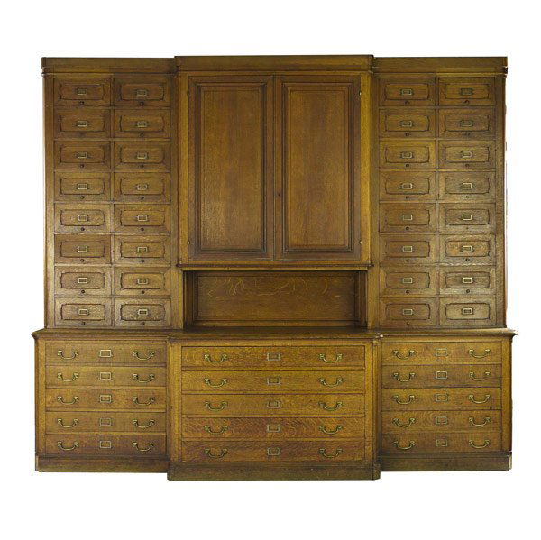 Oak store display case: Oak store display case with multiple drawers, ca. 1900. Probably from a dry goods store, the upper section for shirt storage. 9' 4'' x 10' 8'' x 2' 10''