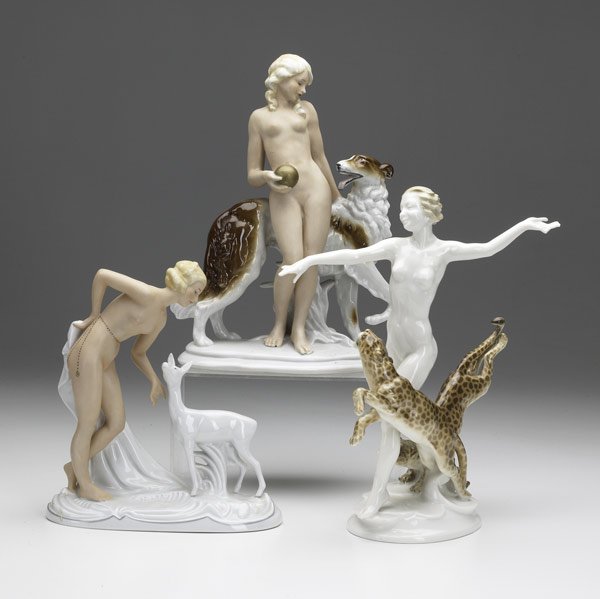 Three porcelain nude figurines: Three porcelain nude figurines, all 20th C. Hutschenreuther with cougars; German figures with deer or wolfhound. Tallest: 10 1/2''