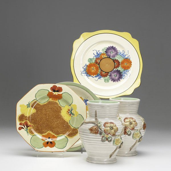Five pieces by Clarice Cliff: Five pieces by Clarice Cliff, English, 20th C. Pair of vases and three plates, all with floral decoration. Tallest: 7''