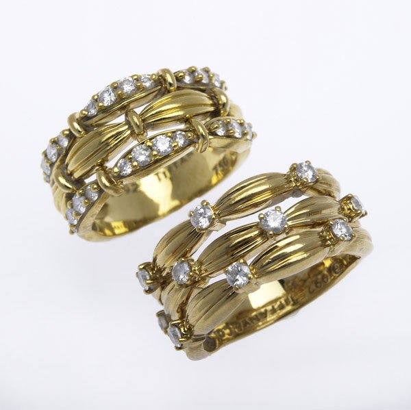 TWO TIFFANY & CO. SIGNATURE DIAMOND RINGS : TWO TIFFANY & CO. SIGNATURE DIAMOND RINGS 18k yg, ca. 1992, approx. 1.0 cts. TW. 17.7 gs. GW. Sizes 6 and 7.