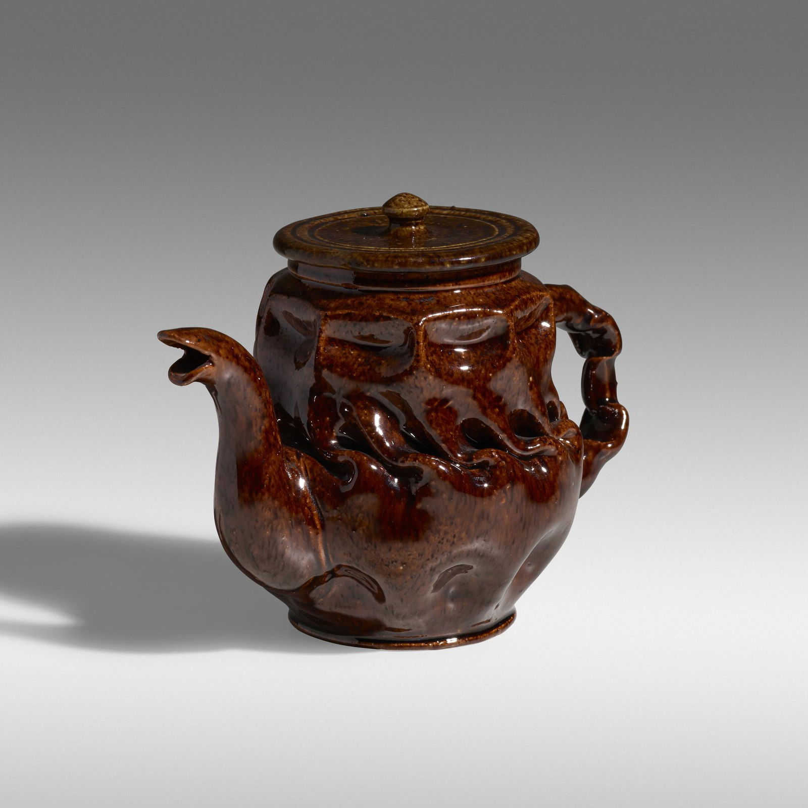 George E. Ohr, Teapot: George E. Ohr Teapot USA, 1895-96glazed earthenware5 h × 6.75 w × 4 d in (13 × 17 × 10 cm) Teapot features an in-body twist with dimples and pinches with a speckled brown
