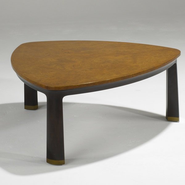 EDWARD WORMLEY / DUNBAR Coffee table: EDWARD WORMLEY DUNBAR Burlwood and sculpted walnut coffee table on brass feet (no. 6029), c. 1950s Rectangular brass tag, paper label 14 1/2'' x 33''
