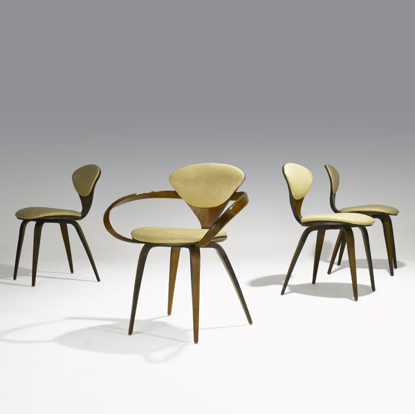 NORMAN CHERNER / PLYCRAFT Set of four chairs: NORMAN CHERNER PLYCRAFT Set of four laminated walnut dining chairs, one arm- , three side- with vinyl upholstery Three with Plycraft paper labels Armchair: 31 1/2'' x 26'' x 22''