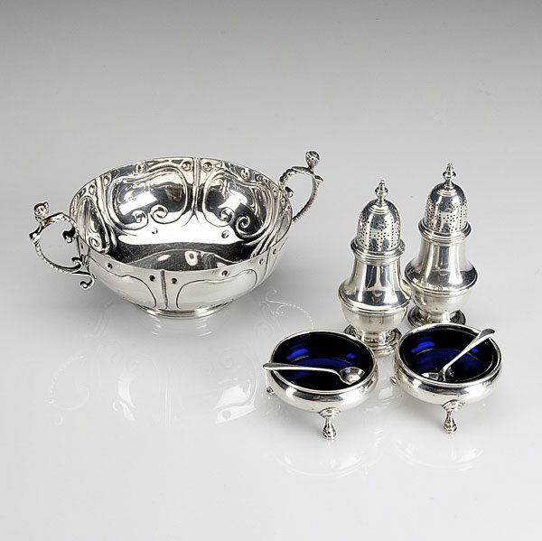 CARTIER & TIFFANY TABLE ACCESSORIES: CARTIER & TIFFANY Cartier sterling wedding cup in a reproduction of the Simeon Soumain pattern, ca. 1720. Together with two sterling salt cellar/pepperette sets, the salts with cobalt liners.