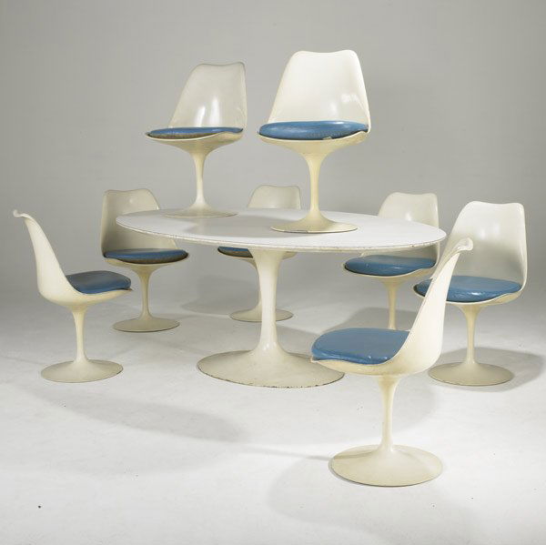 EERO SAARINEN / KNOLL TULIP DINING TABLE & CHAIRS: EERO SAARINEN FOR KNOLL ASSOCIATES Oval tulip dining table with laminate top and eight side chairs with vinyl upholstery. Table: 70 1/2'' x 78 1/2'' x 48''. Chairs: 32'' x 19'' x 17''