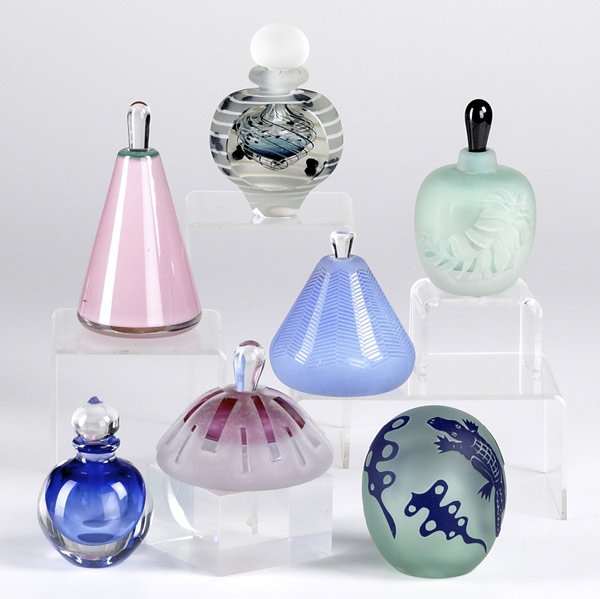 CONTEMPORARY GLASS: CONTEMPORARY GLASS Two pieces by Gary Genetti: paperweight decorated with alligators and perfume bottle with cobalt interior and clear exterior, both signed. Together with five similar perfume bottles