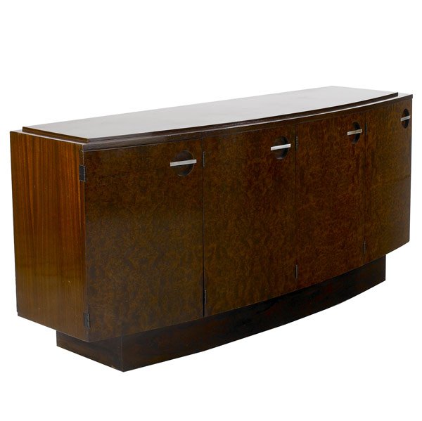 GILBERT ROHDE / HERMAN MILLER 4 DOOR SIDEBOARD: GILBERT ROHDE / HERMAN MILLER Mahogany, burled walnut and rosewood four-door sideboard with steel pulls, with interior divided sliding shelves lined in cork and felt. 33'' x 72'' x 21''