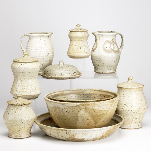 GARY BAXTER STONEWARE: GARY BAXTER Ten pieces of stoneware include cannister set, two similar pitchers, two mixing bowls and a large shallow bowl. Each signed. Tallest: 10 1/2'' x 6 1/2''