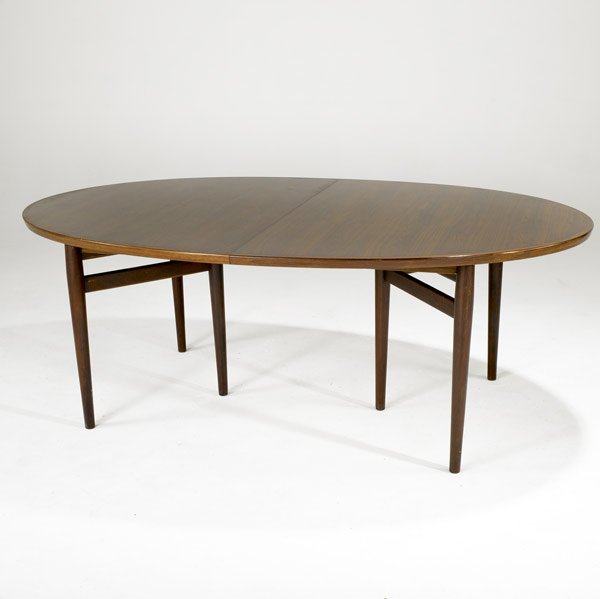 ARNE VODDER FOR SIBAST DINING TABLE: ARNE VODDER FOR SIBAST Rosewood oval dining table on tapered rosewood legs, with two inserts. Unmarked. Table: 28 1/2'' x 78 1/2'' x 48 3/4''. Inserts: 19''