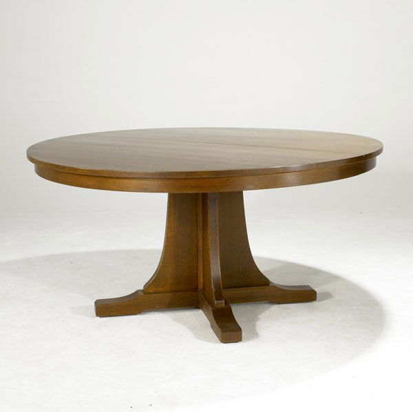 STICKLEY FOR E.J. AUDI DINING TABLE: STICKLEY FOR E.J. AUDI Reproduction pedestal dining table with shoe feet and two leaves. Branded Stickley. 32 1/2'' x 63'' dia. Leaves: 15''