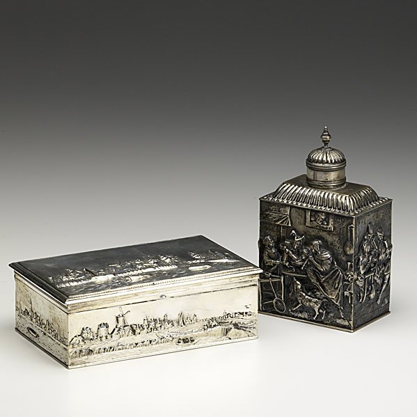 TWO PIECES OF DUTCH REPOUSSE SILVER: TWO PIECES OF DUTCH REPOUSSE SILVER; Tea caddy, .833 standard, 1908, and rectangular casket with hinged lid; 18.45 OT; Tallest: 5 1/4''