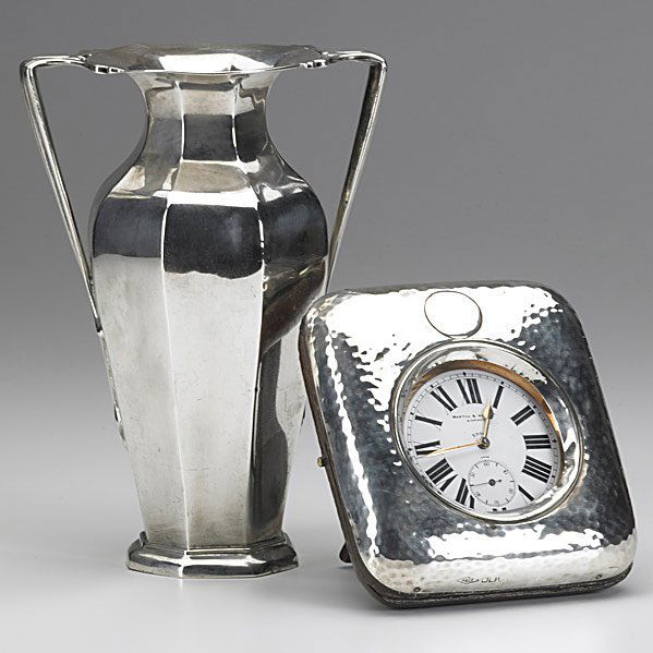 ENGLISH SILVER: ENGLISH SILVER; Two pieces, 20th c.; Edwardian two-handled vase by Goldsmiths & Silversmiths Co. Ltd, London, 1902, 10.6 OT, 7''; Mappin & Webb 2 3/4'' 'D' Clock, pin-set, stem wound, in silver-faced