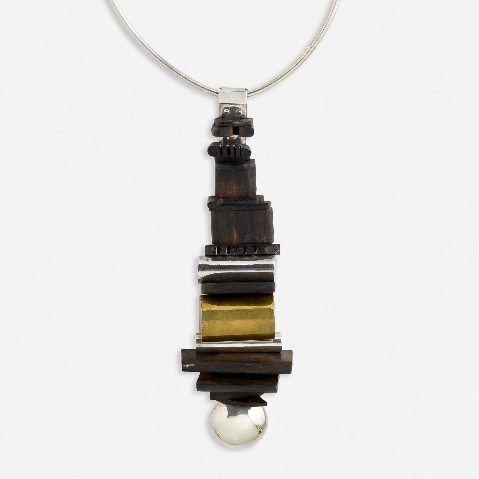 Robert Lee Morris, Wood, brass, and silver necklace: Robert Lee Morris Wood, brass, and silver necklace The silver choker, suspending a large totem pendant of silver cylinders alternating with variously-shaped wood panels, c. 1975 Silver, brass-plated s