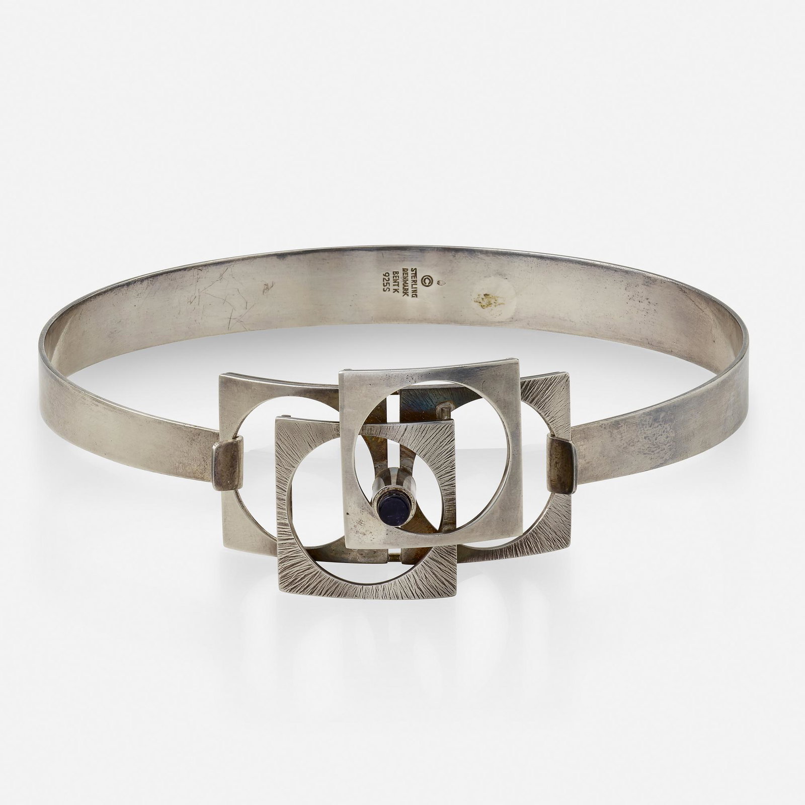 Bent Knudsen, Sterling silver and amethyst necklace: Bent Knudsen Sterling silver and amethyst necklace A hinged collar necklace with a geometric pendant set with a flat-top cylindrical amethyst Sterling silver Pendant and necklace signed Bent K, numbe