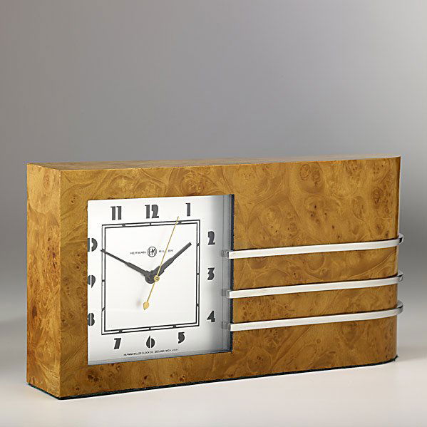 GILBERT ROHDE; HERMAN MILLER World's Fair Clock: GILBERT ROHDE; HERMAN MILLER; World's Fair Clock, burlwood veneer and chrome plated steel; Brass tag; 6 3/4'' x 13 1/4'' x 2 1/2'' Class: CL Manufacturer: HERMAN MILLER Artist:Rohde, Gilbert