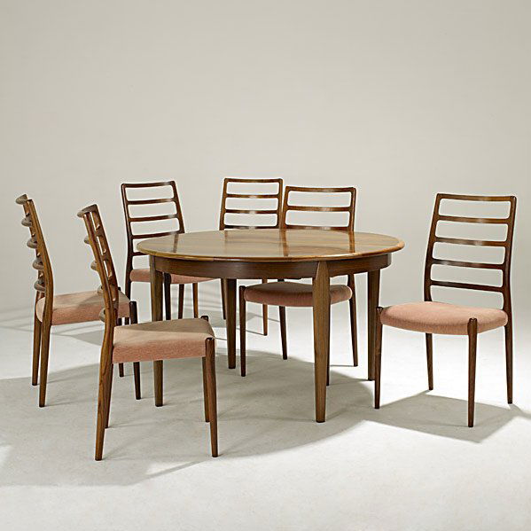 NIELS O. MOLLER; J.L. MOLLER MOBELFABRIK Suite: NIELS O. MOLLER; J.L. MOLLER MOBELFABRIK; Large rosewood dining suite: banquet sized table, ten chairs (six pictured); With three leaves; Branded Danish control label to chairs; Table: 28 3/4'' x 49 1