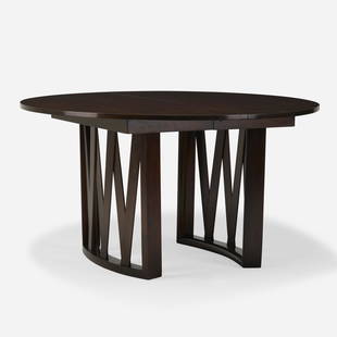 In the manner of Paul Frankl, Dining table: In the manner of Paul Frankl Dining table USA, c. 1965lacquered mahogany 29 h &times; 53.25 dia in (74 &times; 135 cm) This work will ship from Rago in Lambertville, New Jersey.</