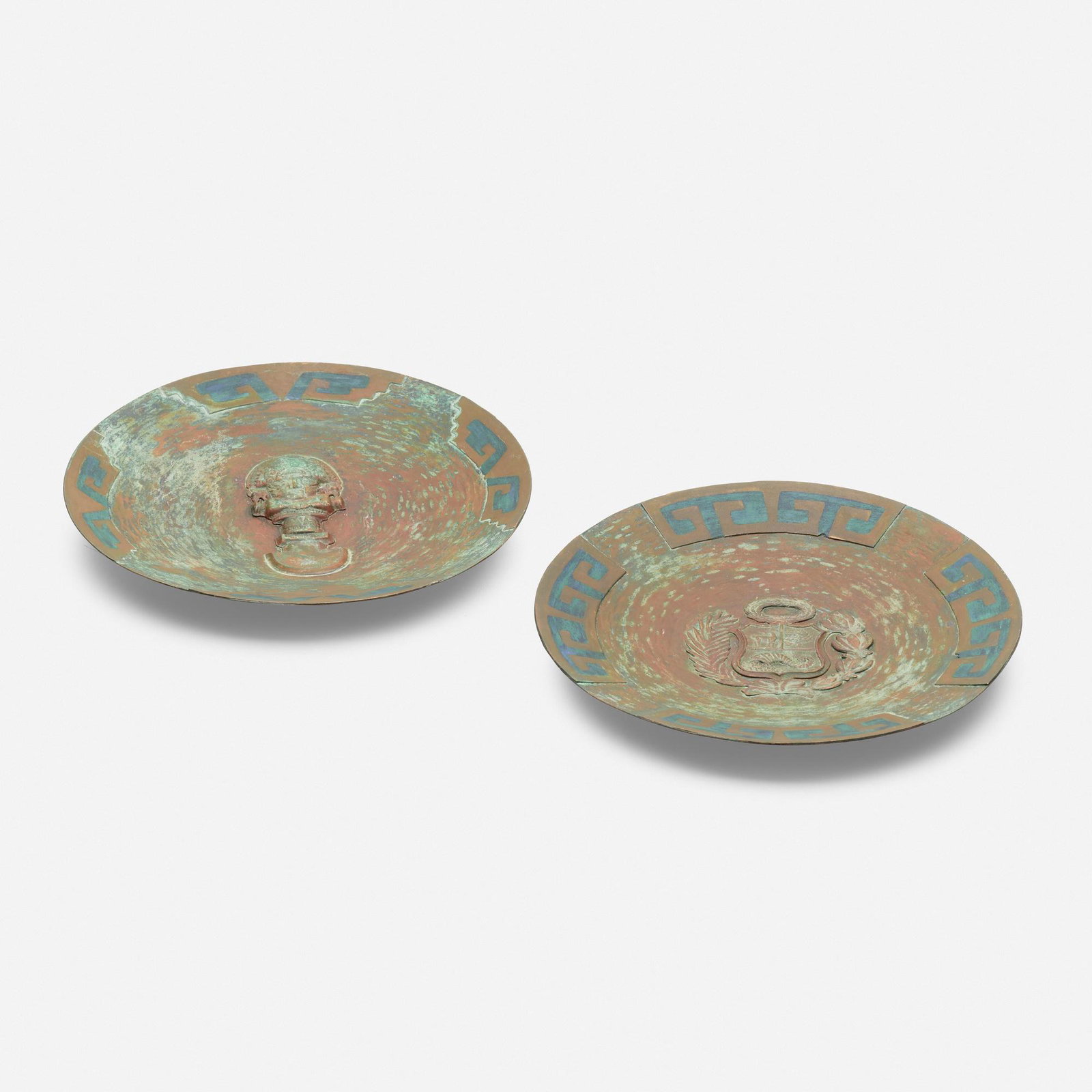 Pepe Mendoza, Chargers, set of two: Pepe Mendoza Chargers, set of two Mexico patinated copper 1 d × 7.5 dia in (3 × 19 cm) Plates feature the coat of arms of Peru and a warrior. Impressed manufacturer's mark to verso
