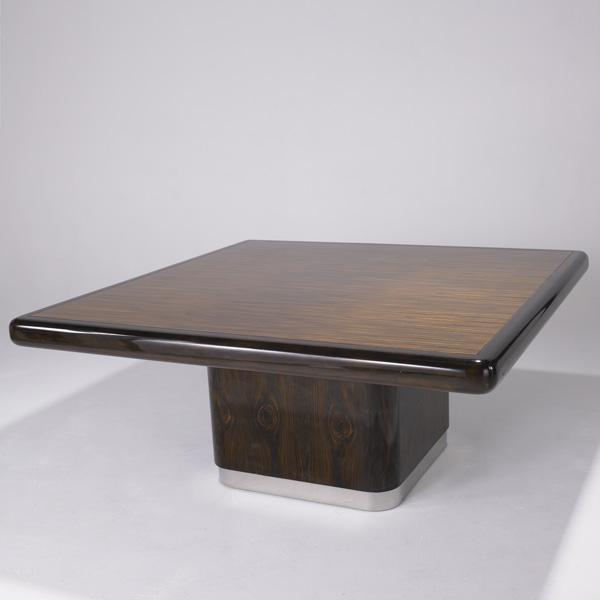 KARL SPRINGER: KARL SPRINGER; Dining table with large square Madagascar ebony top edged with a mahogany border, on a recessed base of crotch Madagascar ebony terminating in a chrome plinth base; 29 1/2'' x 67'' x 67