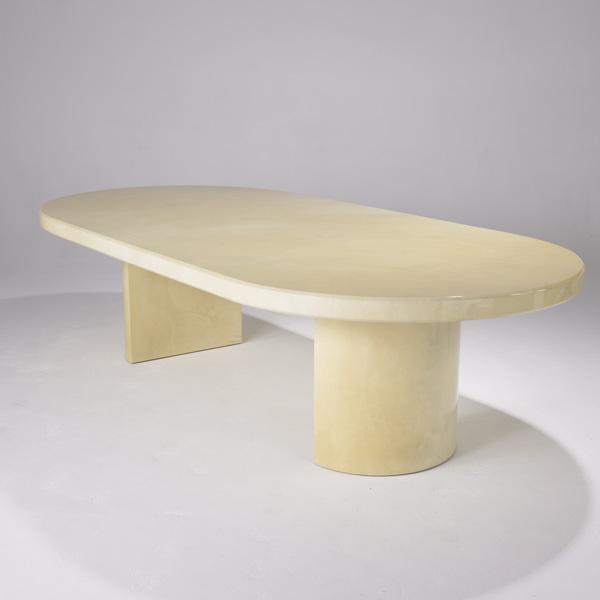 KARL SPRINGER: KARL SPRINGER; Racetrack dining table covered in lacquered parchment on a pair of semi-circular pedestals; 29'' x 110'' x 53''