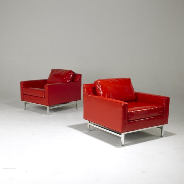 SELIG: SELIG; Pair of club chairs in glossy vinyl upholstery on polished aluminum base; 28'' x 31 1/2'' x 34''