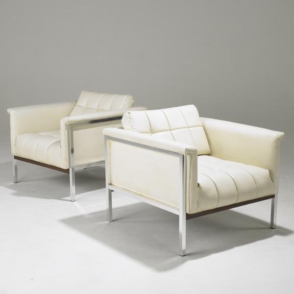 SELIG: SELIG; Pair of club chairs with tufted vinyl upholstery on polished aluminum base; 28'' x 31'' x 33''