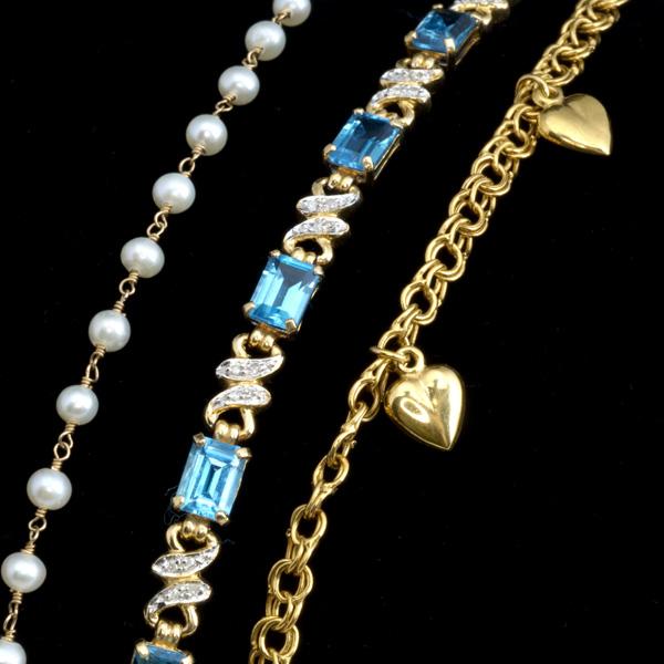 THREE GOLD LINK BRACELETS: THREE GOLD LINK BRACELETS; 14k yg with blue topaz, diamonds and pearls; 19.8 gs., 6 1/2''-9''