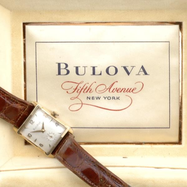 BULOVA MEN'S WATCH: BULOVA MEN'S WATCH; Gold curved tank watch, 21 jewels, white engine-turned face with subsidiary seconds; In original case