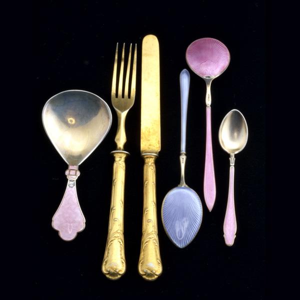 FRENCH AND SCANDINAVIAN FLATWARE: FRENCH AND SCANDINAVIAN FLATWARE; Eighteen piece partial gilt metal fruit service by Christofle together with a set of twelve enameled silver gilt spreaders and other similar Scandinavian pieces by va