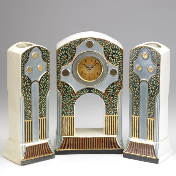 AUSTRIAN GARNITURE SET: AUSTRIAN GARNITURE SET; Glazed ceramic, Secessionist pattern, clock and two vases; Each: 12''