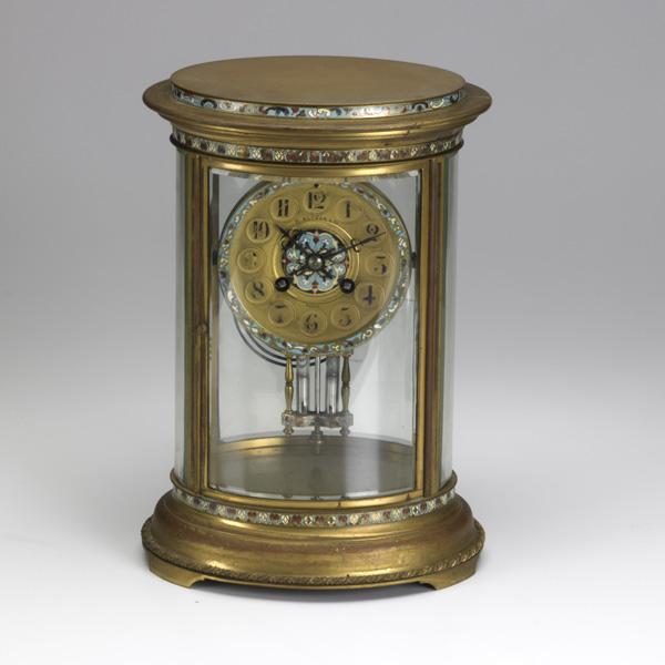 FRENCH CRYSTAL REGULATOR CLOCK: FRENCH CRYSTAL REGULATOR CLOCK; Oval with champleve decoration, time and strike, mercury pendulum, early 20th c.; 11''