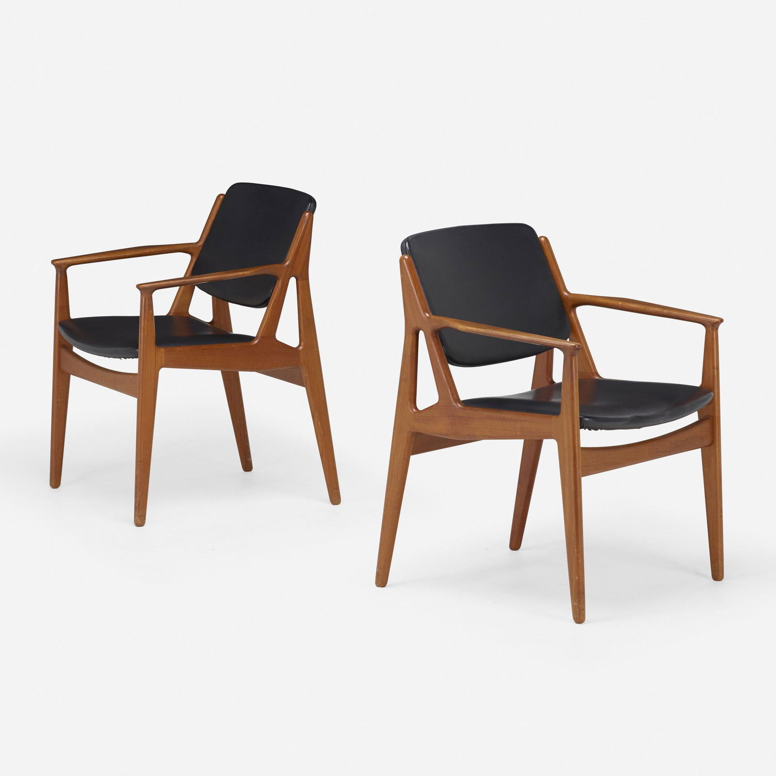 Arne Vodder, Armchairs, pair: Arne Vodder Armchairs, pair Vamo SonderborgDenmark, 1955teak, Naugahyde 31 h × 25 w × 24 d in (79 × 63 × 61 cm) Branded manufacturer's mark to underside of each e