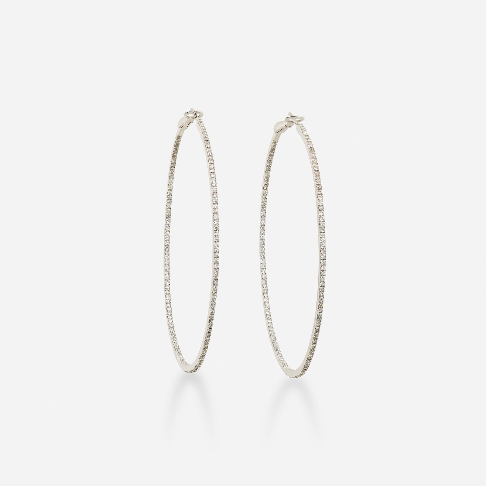 White gold and diamond hoop earrings: White gold and diamond hoop earrings Set with round brilliant-cut diamonds 18k white gold 2 ½ ins; Gross weight 7.5 dwts