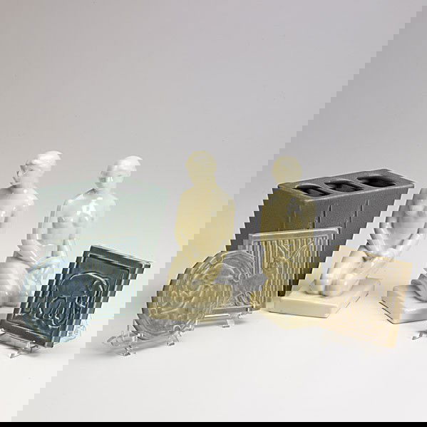 ROOKWOOD: ROOKWOOD; Six production pieces include three trivets, pair of bookends and a vase; All marked; Tallest: 7''