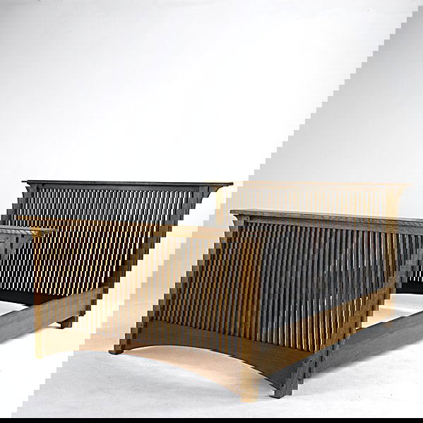 ROBERT WALSH: ROBERT WALSH; Contemporary Prairie style queen-size spindled bed frame with long corbels and arched footrail; 44'' x 72'' x 88''