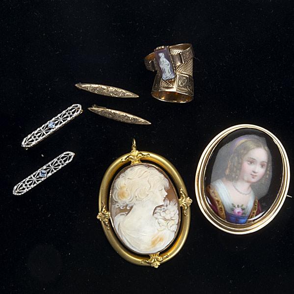 VICTORIAN JEWELRY: VICTORIAN JEWELRY; Shell cameo pendant mounted in bloomed 14k yg, cameo ring in 14k yg size 7, 14k yg thimble, painted porcelain brooch of a small child mounted in 10k yg and four handy pins in 14k an