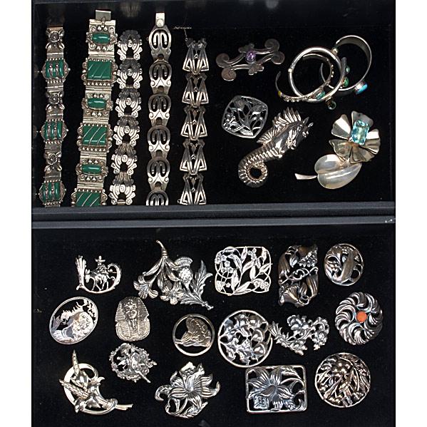 COLLECTION OF SILVER JEWELRY: COLLECTION OF SILVER JEWELRY; Five Mexican link bracelets, three cuffs, Mayan style brooch with amethyst and twenty brooches, many in the Arts & Crafts style
