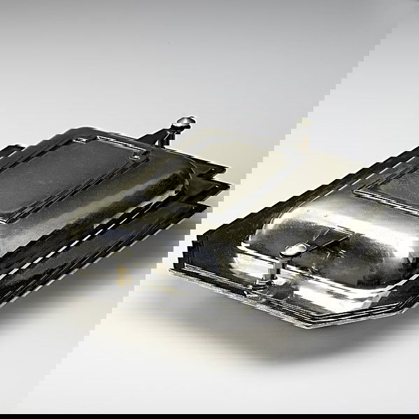 LOUIS W. RICE / BERNARD RICE'S SONS: LOUIS W. RICE; BERNARD RICE'S SONS; Silverplated Skyscraper serving dish, ca. 1928; Stamped Skyscraper Des. Pat. Pending Apollo EPNS Made by Bernard Rice's Sons Inc. 5251; 3 1/2'' x 11 3/4'' x 9 1/2''