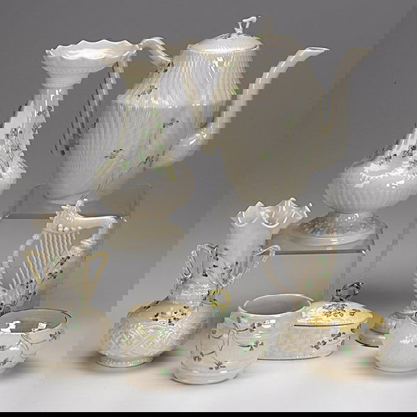 BELLEEK: BELLEEK; Thirty-four pieces ''Shamrock'' pattern include: teapot, three sugars (one lidded), five vases and cups and saucers, 20th c.; All with green marks; Tallest: 8''